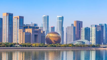 A skyline of a city shot from across a river.