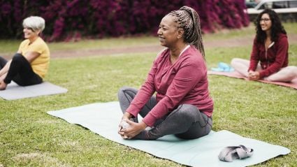 woman sitting on a yoga mat 