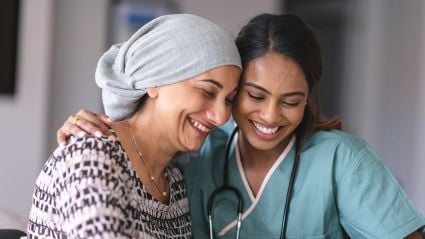 A patient and a doctor laughing together.