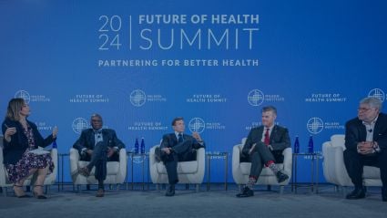 Five people seated on a stage during a panel at the 2024 Milken Institute Future of Health Summit.