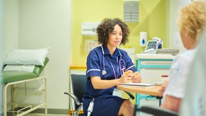 medical provider and patient in medical room having a conversationn