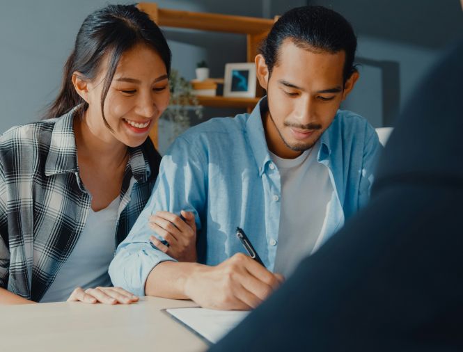 a couple looking over financial documents