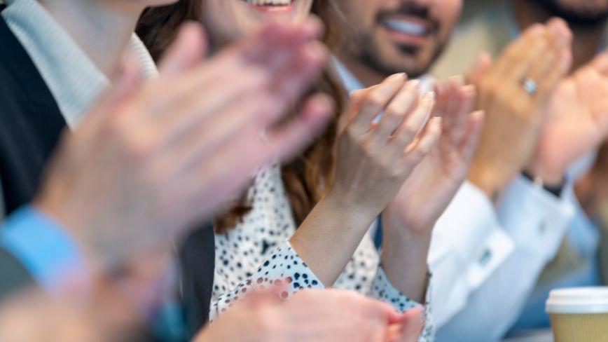 close up of people clapping