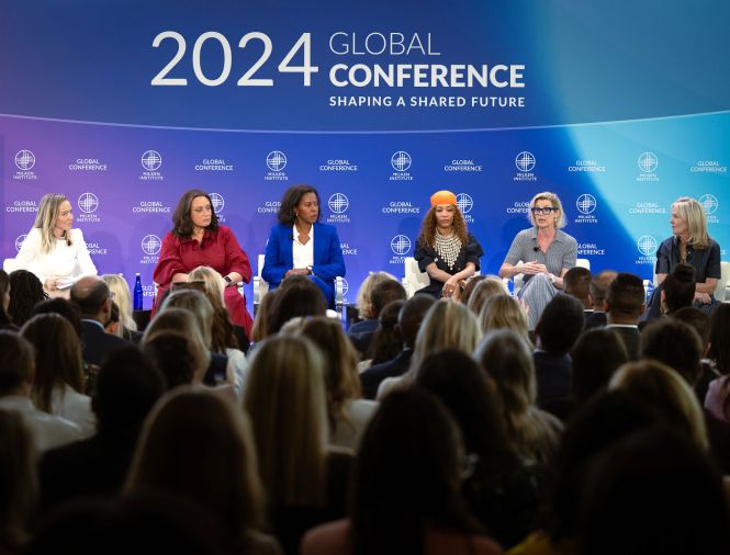 various speakers discussing a topic on a panel at global conference 2024