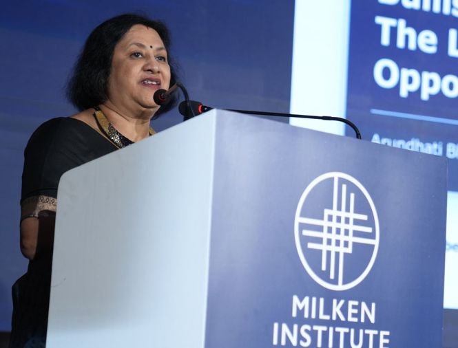 person speaking at a milken institute global dinner dialogues in Mumbai