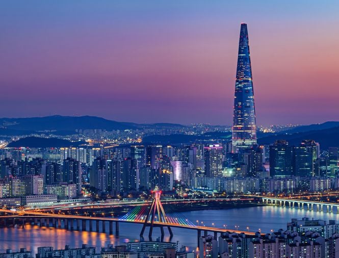 view of city in south korea with pink and purple skies