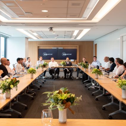 A group of people are at a roundtable