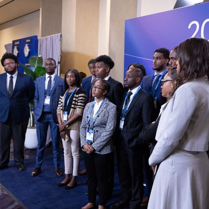 A group of people stand together at an event