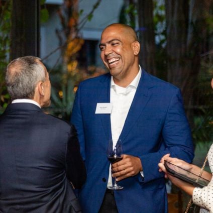 small group of people at the Milken Institute Brazil Global Dinner Dialogues talking