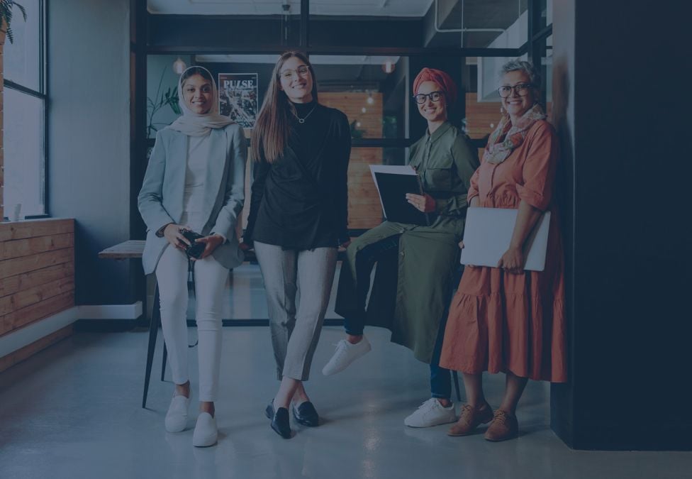 four women in a professional setting