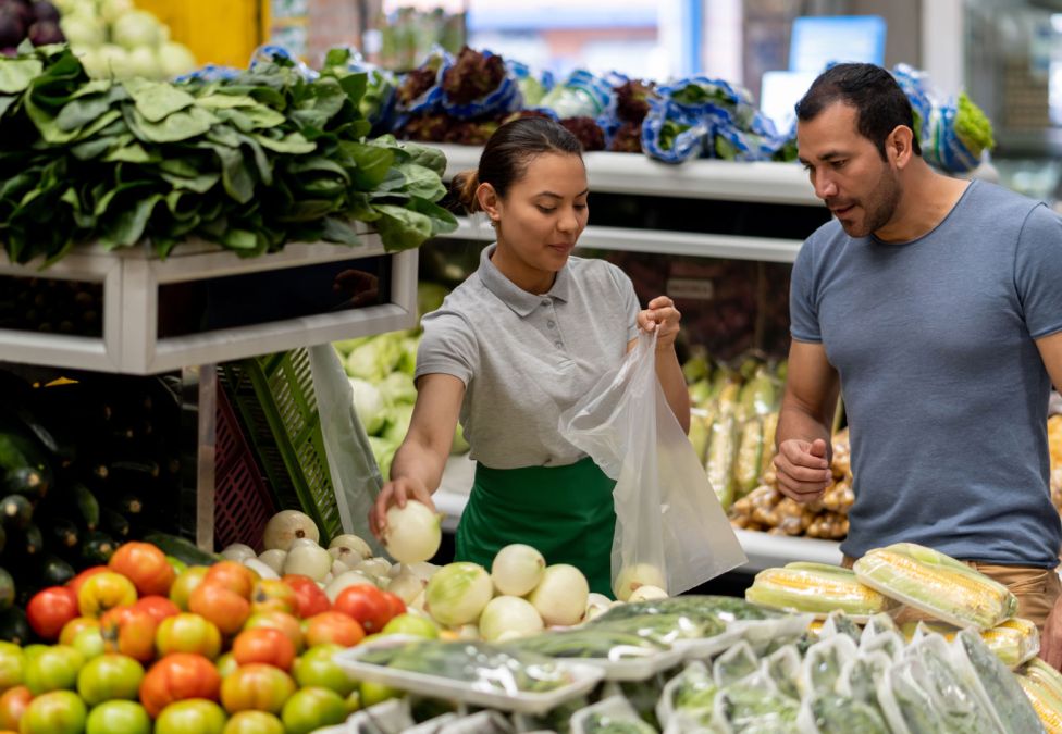 two people shopping in produce section