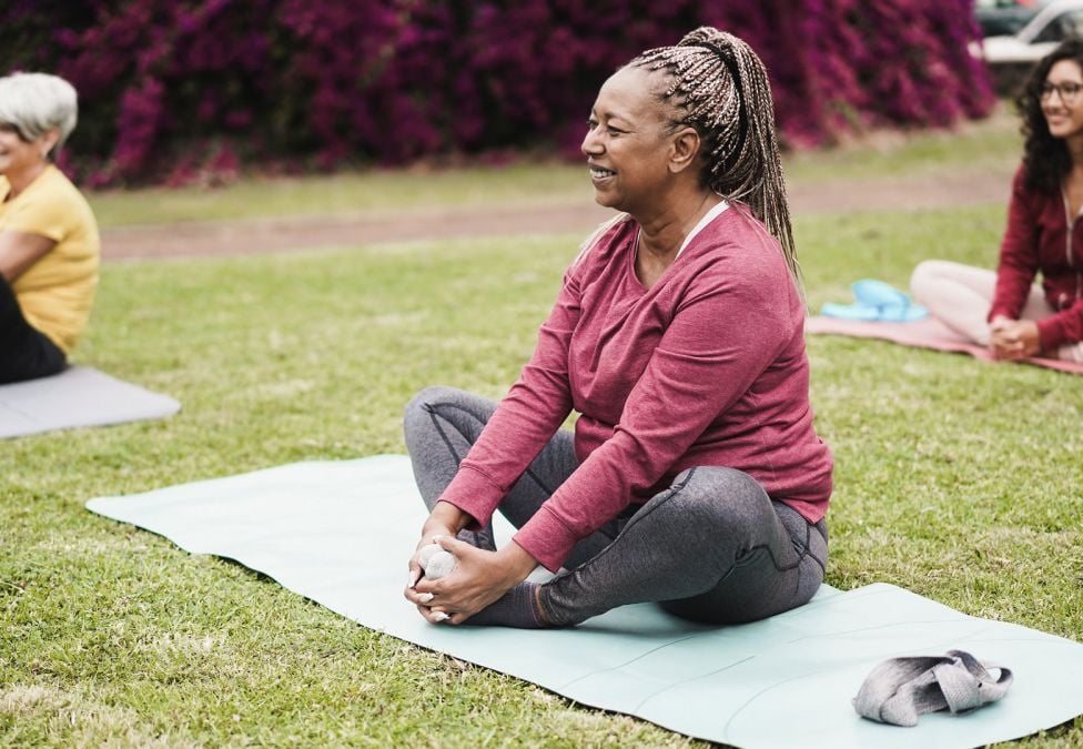 woman sitting on a yoga mat 